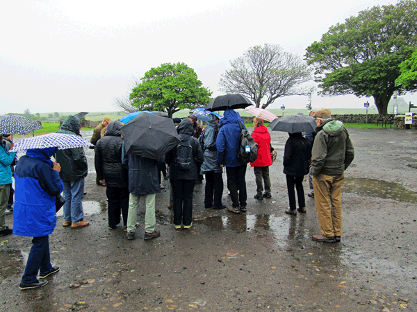 The group assemble in the pouring rain - the only rain in the whole trip